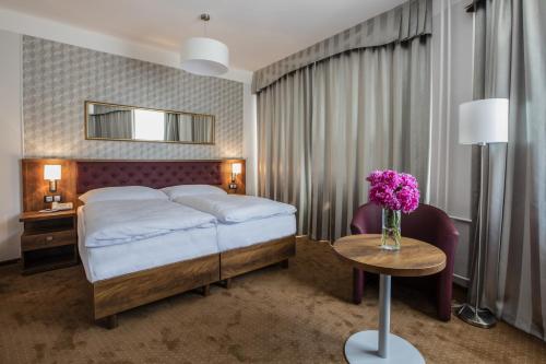 Кровать или кровати в номере Hotel Bellevue Tlapak