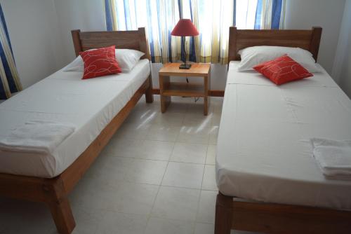 Postel nebo postele na pokoji v ubytování ManFiyo Guest House