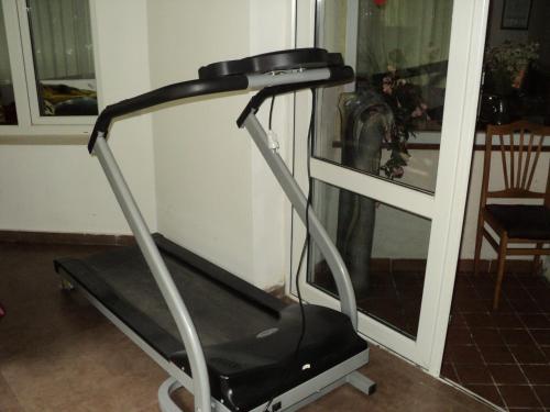 a treadmill in a room next to a window at EcoRest - Likani Palace in Borjomi