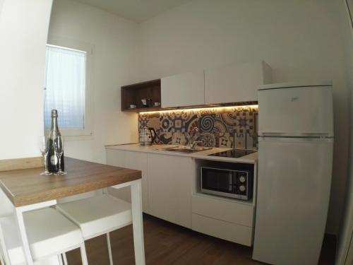 Una cocina o zona de cocina en Caelum Case Vacanza