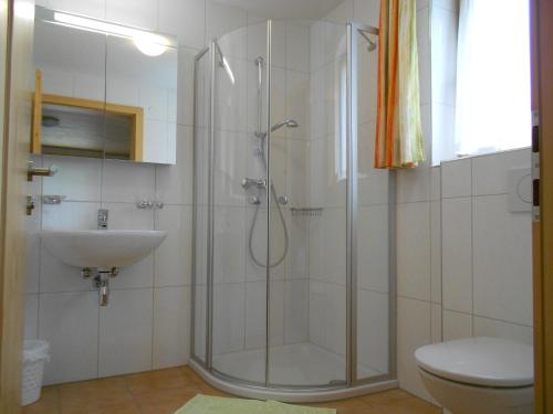 a bathroom with a shower and a sink at Ferienhaus Pfeifer in Gaschurn