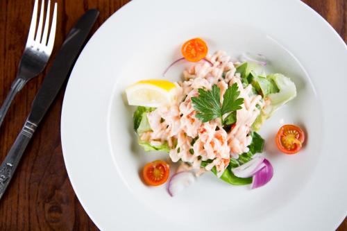 a plate of tuna salad with lettuce and tomatoes at Bowburn Hall Hotel in Durham
