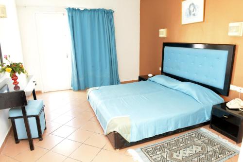 Ένα ή περισσότερα κρεβάτια σε δωμάτιο στο Miramar Sharm El Kantaoui