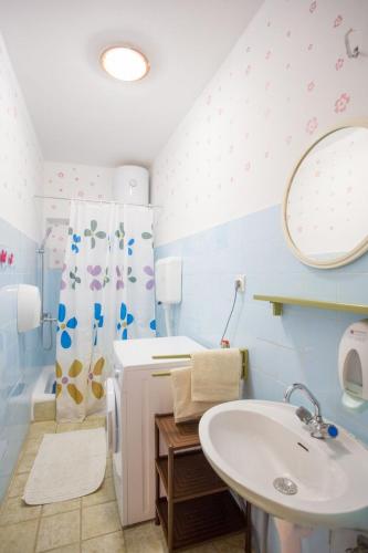 a bathroom with a sink and a mirror at Robinson Elizabeta in Hvar