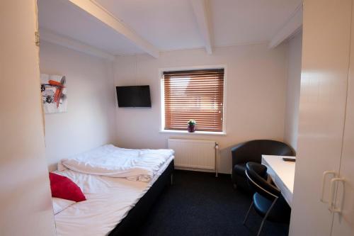 Ένα ή περισσότερα κρεβάτια σε δωμάτιο στο Benniksgaard Bed & Breakfast