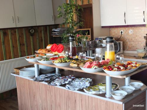 a buffet with many different types of food on it at Anatolia cave hotel Pension in Goreme