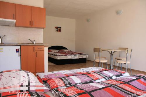 A bed or beds in a room at Penzion Atlas