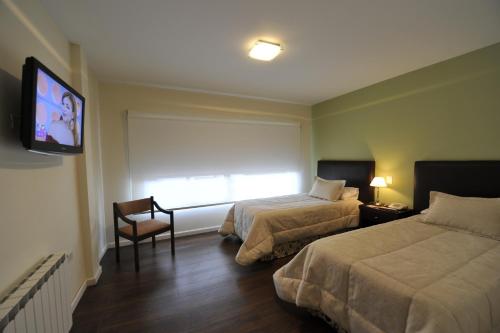 Säng eller sängar i ett rum på Hotel Comercio