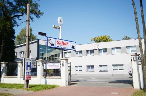 a mobil gas station in front of a building at Willa Sailor Pabianice in Pabianice