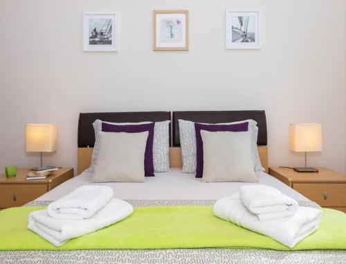 Postel nebo postele na pokoji v ubytování La Vita e Bella Apartment