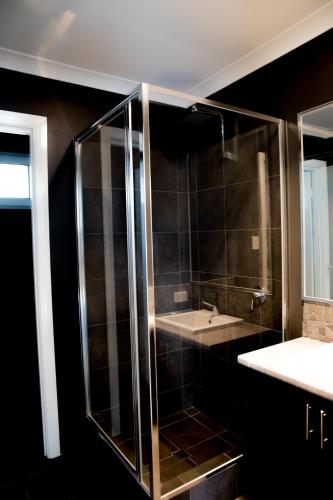 a bathroom with a shower and a sink at Premalaya in Yallingup