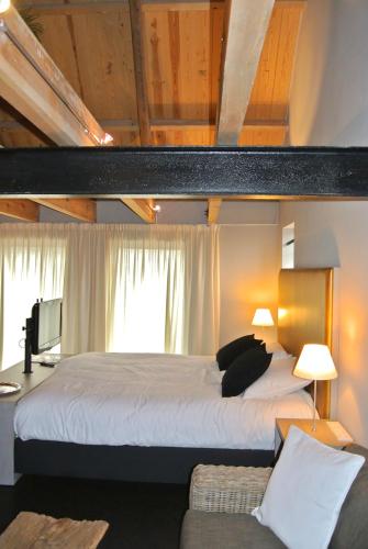 Postel nebo postele na pokoji v ubytování Fletcher Hotel-Restaurant Kasteel Coevorden