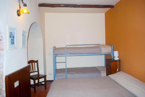 מיטה או מיטות בחדר ב-Agriturismo Fattoria di Grenne