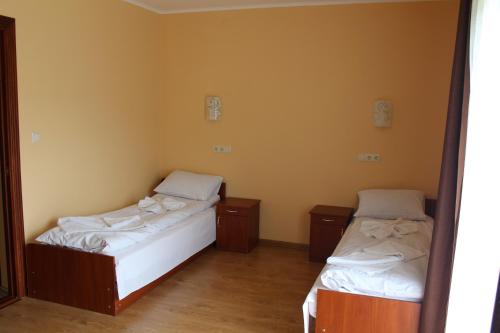 Кровать или кровати в номере Sukhoviia