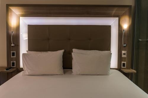 
Cama ou camas em um quarto em Novotel RJ Praia de Botafogo
