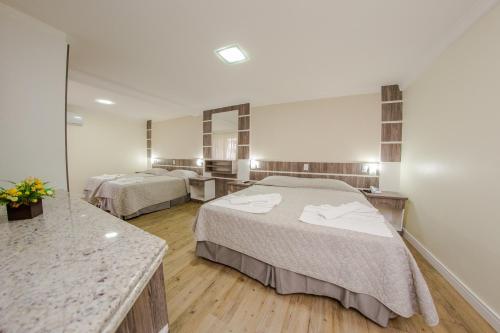 Voodi või voodid majutusasutuse Hotel Kirst toas
