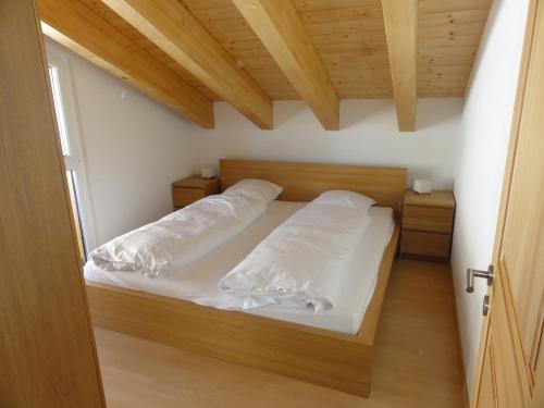 מיטה או מיטות בחדר ב-Apartment Amore