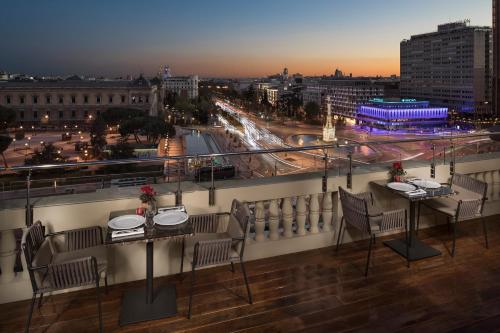 a restaurant with a lot of tables and chairs at Hotel Fenix Gran Meliá - The Leading Hotels of the World in Madrid