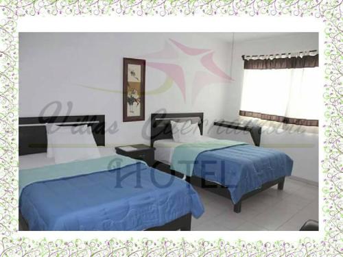 Cama o camas de una habitación en Hotel Villas Cuernavaca