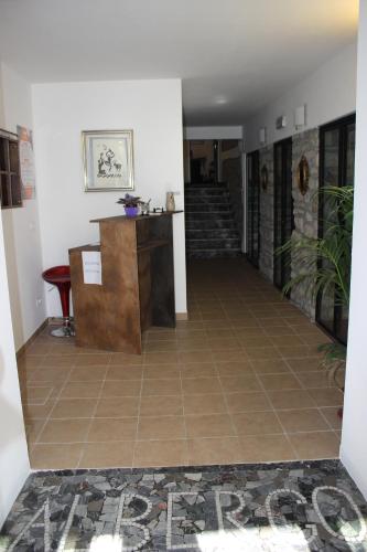 a hallway of a house with a tile floor at Albergo Ristorante Bismantova in Castelnovo neʼ Monti