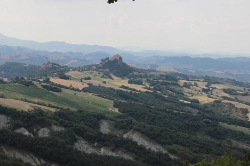 a view of a valley with mountains and trees at Albergo Ristorante Bismantova in Castelnovo neʼ Monti