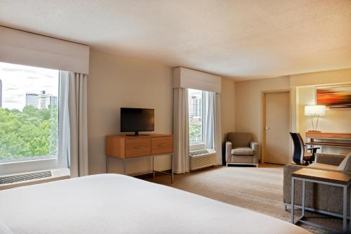 a hotel room with a bed and a television at Holiday Inn Little Rock - Presidential Downtown by IHG in Little Rock