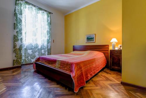 a bedroom with a bed and a large window at Beach Apartment Lana in Split
