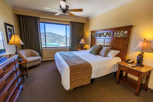 a hotel room with a bed and a large window at Holiday Inn Club Vacations - Tahoe Ridge Resort, an IHG Hotel in Stateline