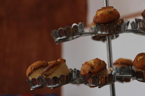 a bunch of muffins on a metal rack at La Capilla Hotel Boutique in Valle de Bravo