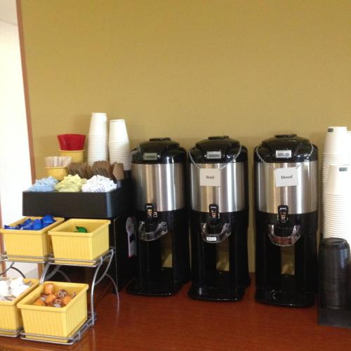 a group of three water heaters sitting on a table at Country Inn & Suites by Radisson, Delta Park North Portland in Portland