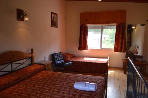 Una cama o camas en una habitación de Cabañas Tranquera 8