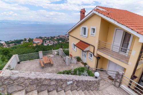 a villa with a view of the ocean at Apartments Belvedere Lovran in Lovran