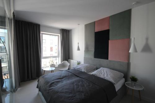 Krevet ili kreveti u jedinici u okviru objekta Nowoczesny apartament Good Morning Gdansk
