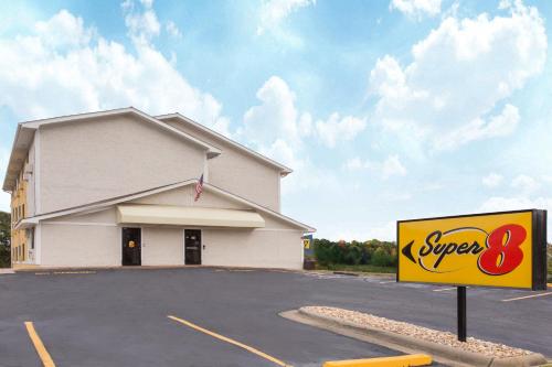 a super sign in front of a store at Super 8 by Wyndham Columbus Airport in Columbus