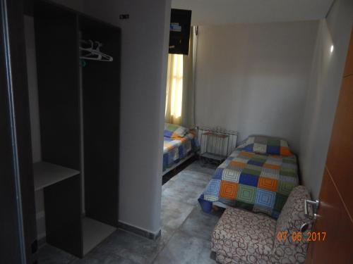 Ένα ή περισσότερα κρεβάτια σε δωμάτιο στο Hotel El Recreo