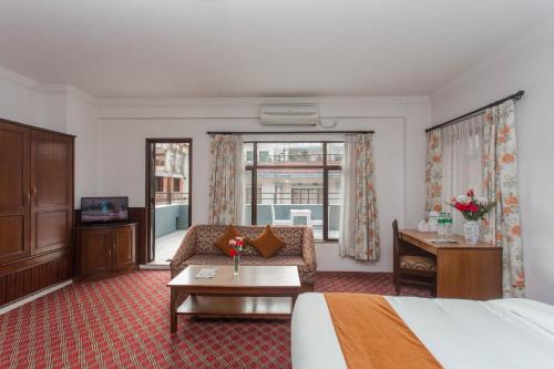 Llit o llits en una habitació de Fuji Hotel