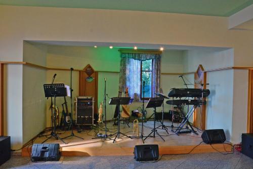 a room with a recording studio with instruments in it at Gasthof Wagner Restaurant-Pension in Halbenrain