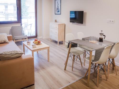 Μια τηλεόραση ή/και κέντρο ψυχαγωγίας στο Apartamenty Opal