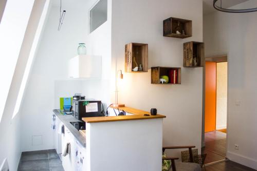 Virtuvė arba virtuvėlė apgyvendinimo įstaigoje Appartements de Jeanne