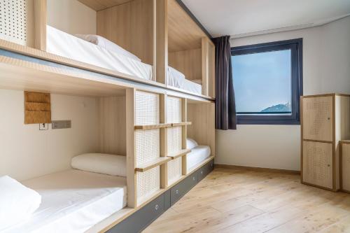 Un ou plusieurs lits dans un hébergement de l'établissement Koisi Hostel
