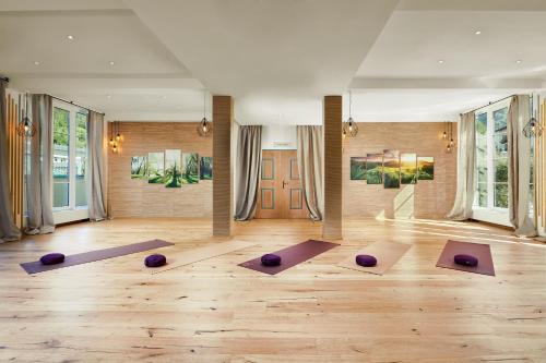 a yoga room with purple pilates balls on the floor at Das Alpenhaus Gasteinertal in Bad Hofgastein