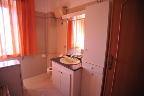 a small bathroom with a sink and a toilet at Palazzo Mascolo gruppo mascololuxuryapartments in Agerola