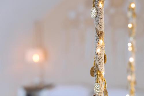 a close up of a christmas tree with lights at Gorgona Traditional 1 in Karpathos Town