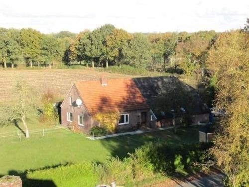 an aerial view of a large house in a field at Ferienhaus Suhr in Wittmund