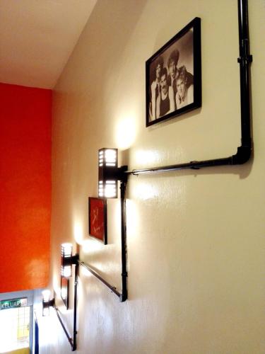 a room with two lights on the wall at JV Hotel @ Simpang Ampat in Simpang Ampat
