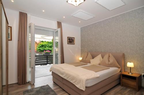 Posteľ alebo postele v izbe v ubytovaní Silver Beach Apartments