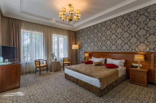 Ένα ή περισσότερα κρεβάτια σε δωμάτιο στο De Volan Boutique Hotel