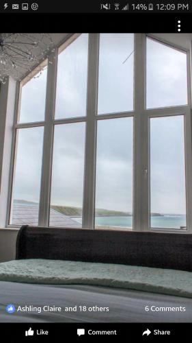 a room with a view of a window with a bed at Wild Atlantic Lodge Bed & Breakfast in Lahinch