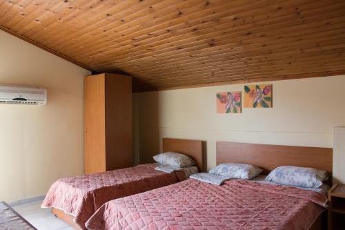 Posteľ alebo postele v izbe v ubytovaní Filia Apartments