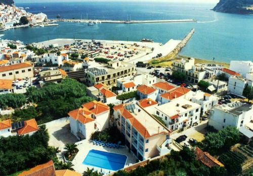 an aerial view of a town next to the water at Dolphin Hotel in Skopelos Town